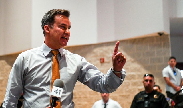 Democratic Texas state Senator Roland Gutierrez interrupts a press conference held by Texas Governor Greg Abbott in Uvalde, Texas, on May 27, 2022. 