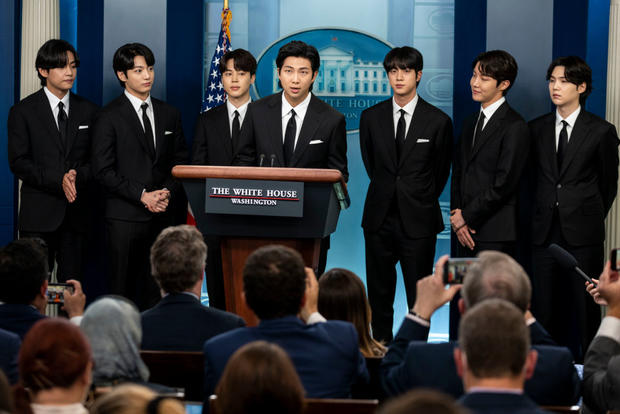 Members of the South Korean pop group BTS, from left to right, V (Kim Taehyung), JK (Jeon Jungkook), Jimin (Park Ji-min), RM Rap Monster (Kim Namjoon), Jin (Kim Seok-jin), J-Hope (Jung Ho-seok) and Suga (Min Yoongi) speak at the daily press briefing at the White House on May 31, 2022, in Washington. 