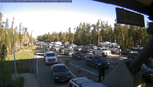 Cars are queued at the entrance to Yellowstone National Park in Montana 