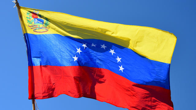 Low Angle View Of Venezuelan Flag Against Clear Blue Sky 