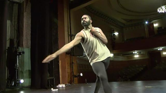 Jerron Herman, who has cerebral palsy, dances on an empty stage. 