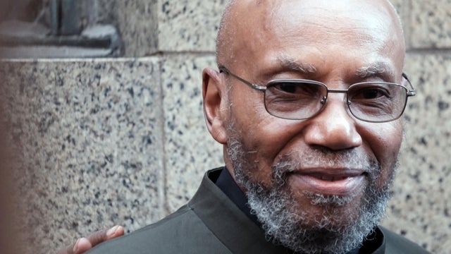 Muhammad Aziz stands outside of a New York City courthouse 