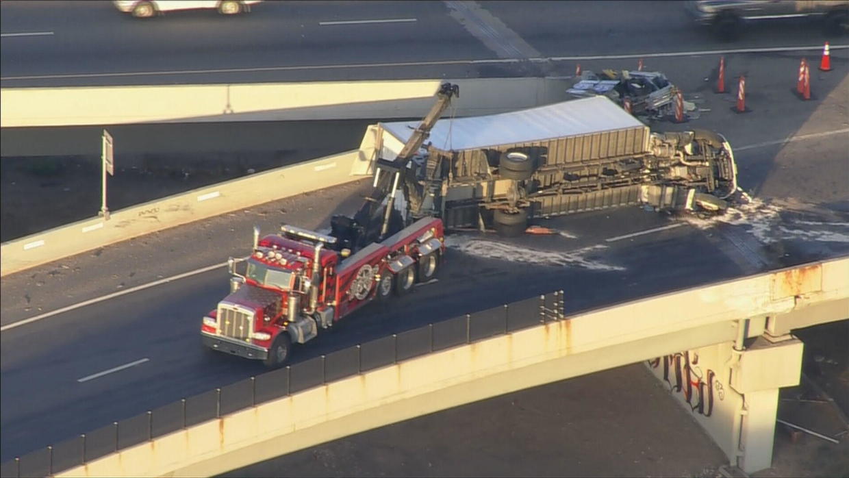 1 Dead After Semi-truck Flips On 6th Ave At I-25 In Denver - CBS Colorado