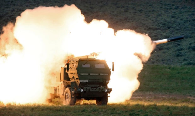 A launch truck fires the High Mobility Artillery Rocket System (HIMARS) produced by Lockheed Martin during combat training in the high desert of the Yakima Training Center in Washington state on May 23, 2011.