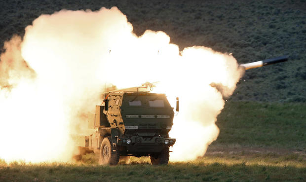 A launch truck fires the High Mobility Artillery Rocket System (HIMARS) produced by Lockheed Martin during combat training in the high desert of the Yakima Training Center in Washington state on May 23, 2011. 