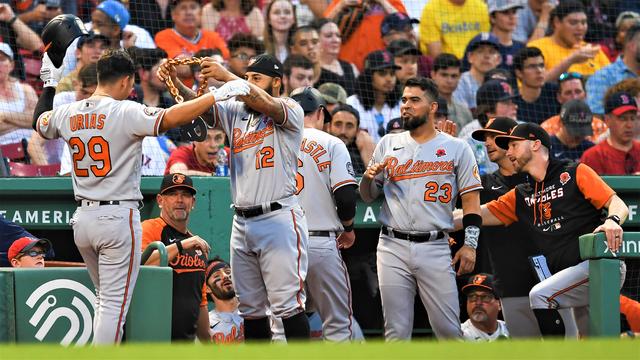 The Orioles celebrate a home run at Fenway Park. 