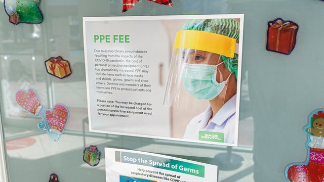 Florida, Miami Beach, dental office with sign about Personal Protection Equipment fee 