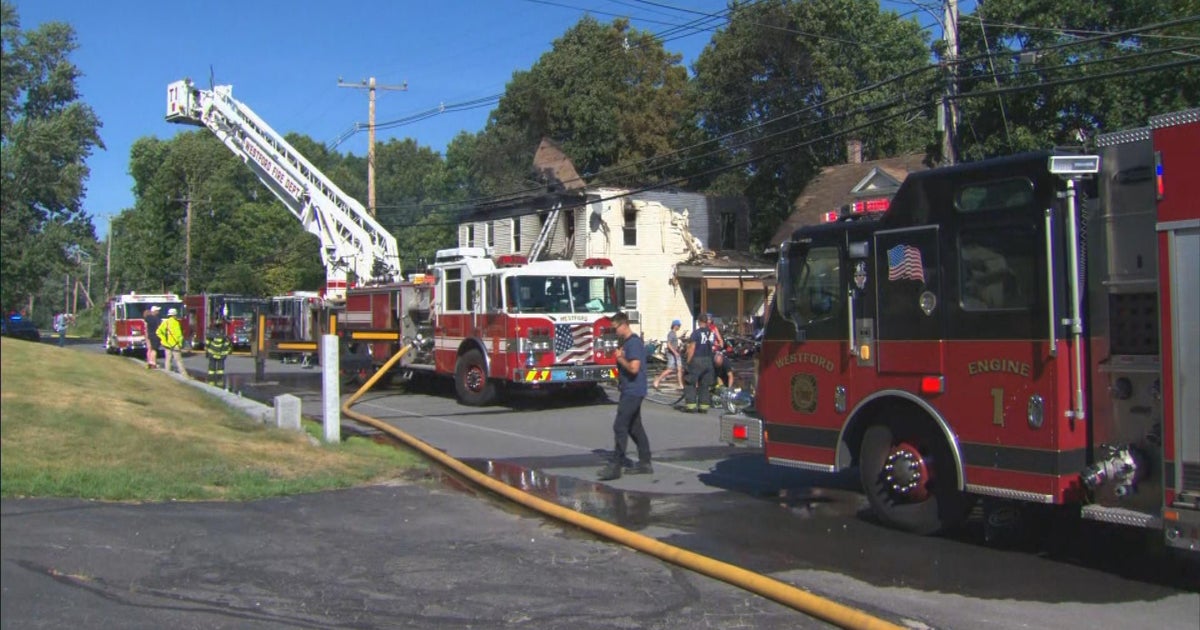 Westford multifamily home a total loss after blaze, firefighters work