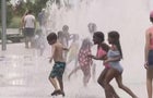 nyc-kids-run-through-sprinkler-heat-wave.jpg 