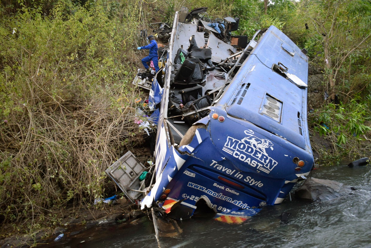 Bus falls off bridge at accident "blackspot" and onto riverbank in