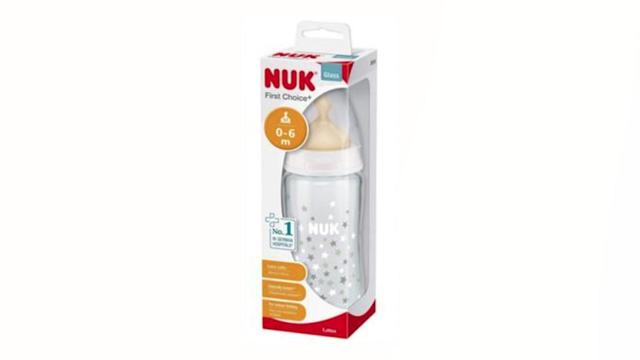 A photo of a glass baby bottle in a box reading NUK. 