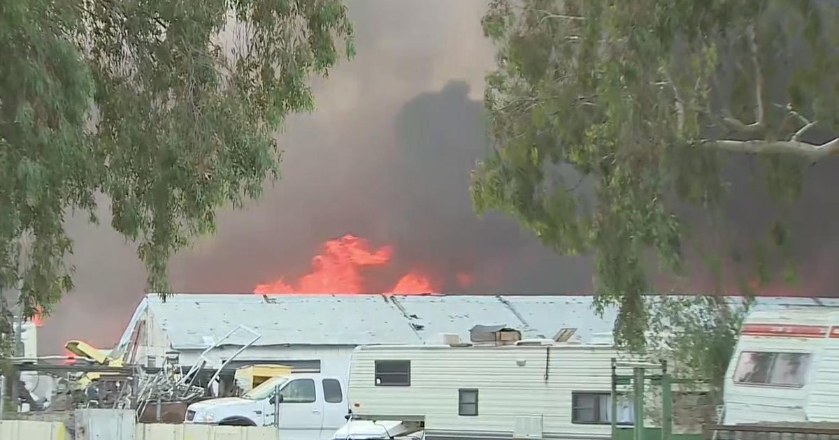 Rio Linda grass fire in junkyard threatens two structures