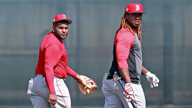 (Fort Myers, FL, 02/16/17) Boston Red Sox third baseman Pablo Sandoval and first baseman Hanley Ramirez walk out to the outfield to shag balls during Red Sox Spring Training on Thursday, February 16, 2017 Staff photo by Matt Stone 