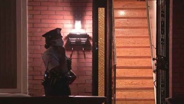 Investigators say they found a 64-year-old woman, stabbed in the neck, in a hallway on the second floor.