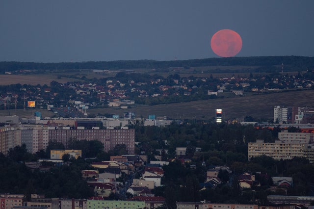 Supermoon setting on the night sky above Slovakia's Kosice 