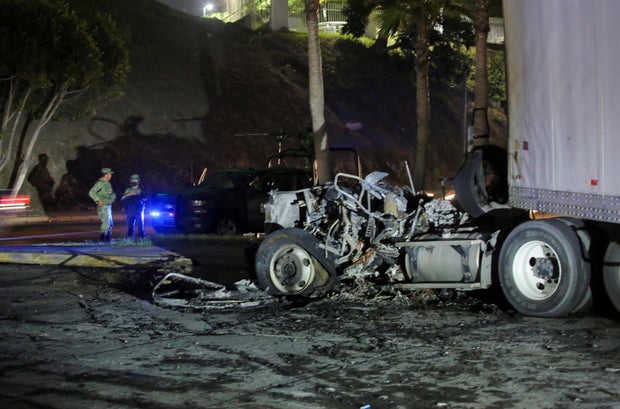 A view shows burnt vehicles after they were set on fire by unidentified individuals in Tijuana 