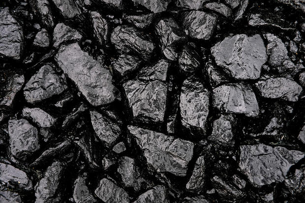coal Gray or black gravel or crushed stone for road construction and reconstruction, poured with bitumen. Preparation and Laying of asphalt. Textured background. Construction industry. 