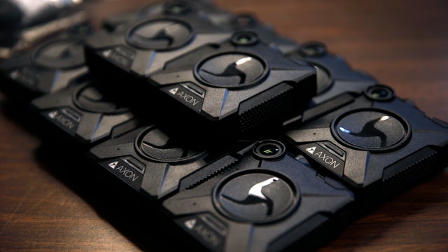 Body worn cameras are distributed to police officers at a training session at the Ingleside police station in San Francisco, Calif. on Sept. 1, 2016. Officers assigned to the Ingleside join others from the Bayview station who have already been outfitted w 