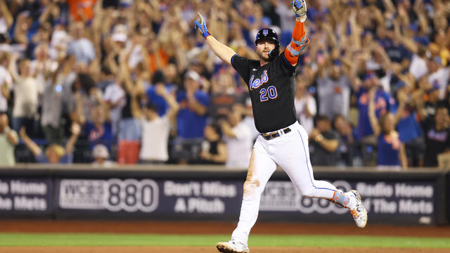 Pete Alonso #20 of the New York Mets hits a walk-off single in the bottom of the ninth inning to defeat the Colorado Rockies 7-6 at Citi Field on August 26, 2022 in New York City. 