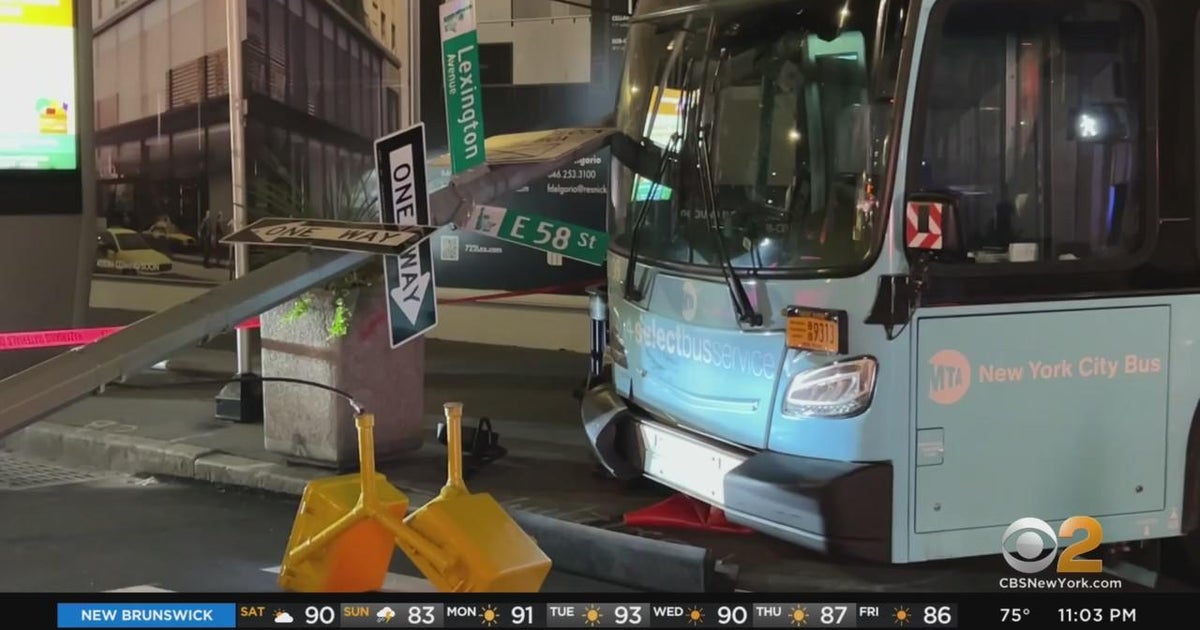 2 people hospitalized after MTA bus hits pole in Midtown - CBS New York