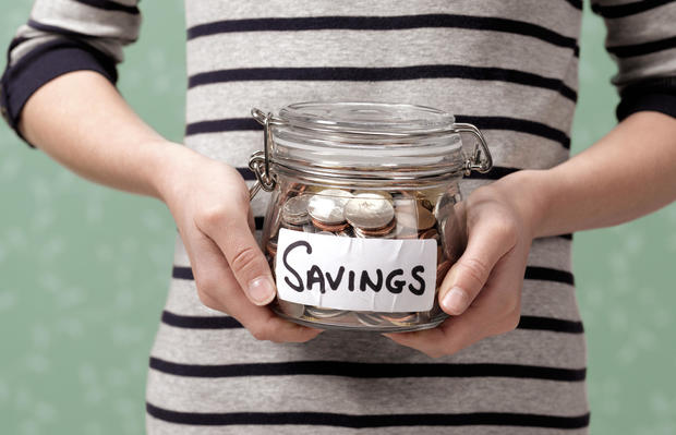 Holding savings in 10-year-old jars 