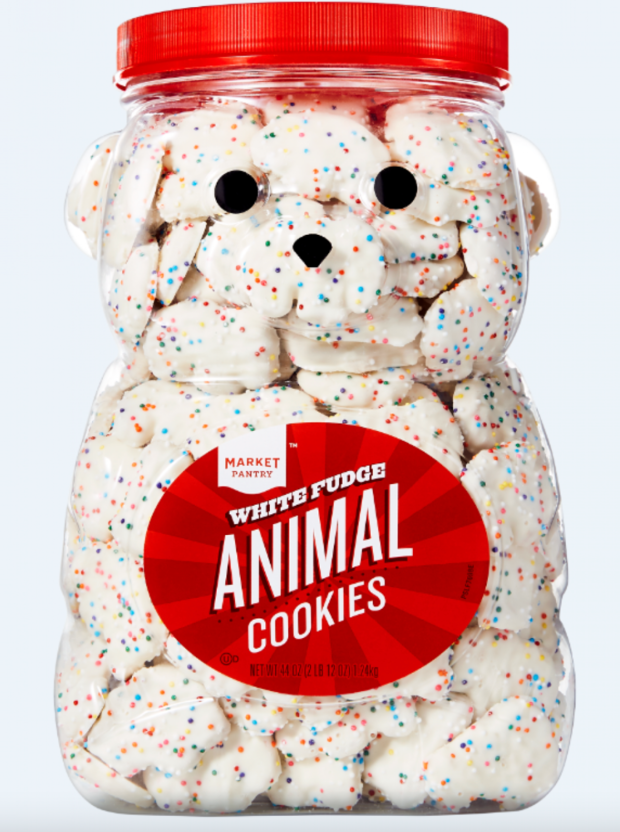 A clear bear-shaped jar holds white cookies covered with sprinkles 