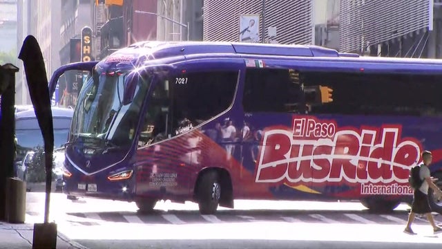 A bus with a logo for "El Paso BusRide International" drives near Port Authority Bus Terminal. 