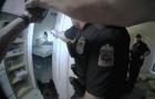 Donovan Lewis is seen on a bed before a Columbus, Ohio, police officer shoots him in this image capture from body camera video Aug. 27, 2022. 