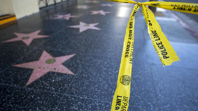 A man was fatally shot early this morning on the Hollywood Walk of Fame, and two suspects were being sought, police said. Police were informed of a ``shooting in progress'' at 1:08 a.m. in the 7000 block of Hollywood Boulevard. 