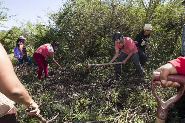 Families of people who have disappeared and several peasant organizations look for clandestine graves in Iguala, Mexico, Nov. 23, 2014. 