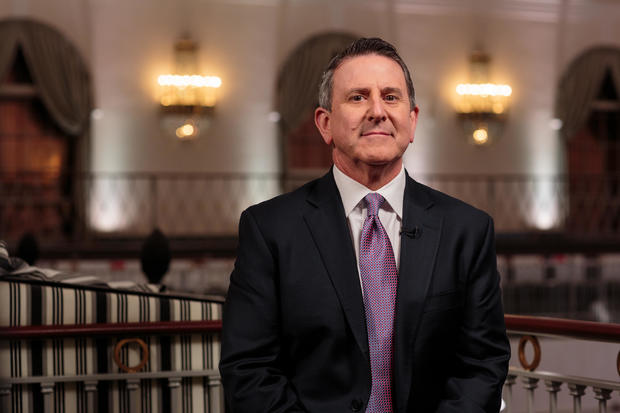Brian Cornell in a suit looking at the camera 