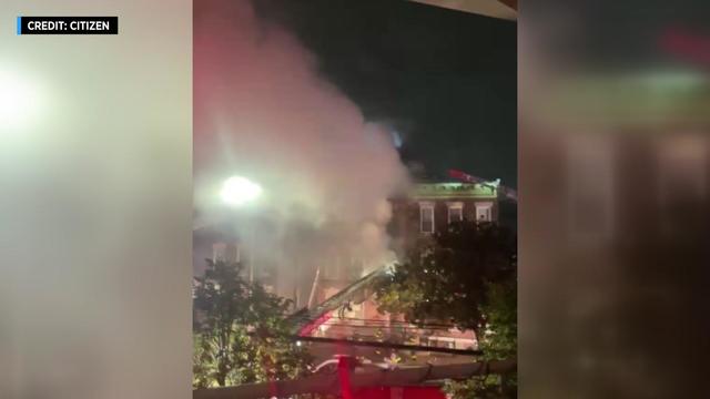 Cellphone video shows thick smoke pouring from the second floor of a three-story building on 42nd Street and 23rd Avenue in Astoria after a fire broke out on Sept. 6, 2022. 