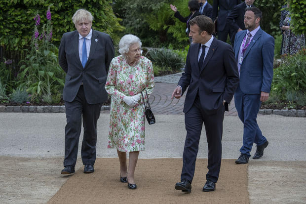 Queen Elizabeth II speaking with French President Emmanuel Macron 