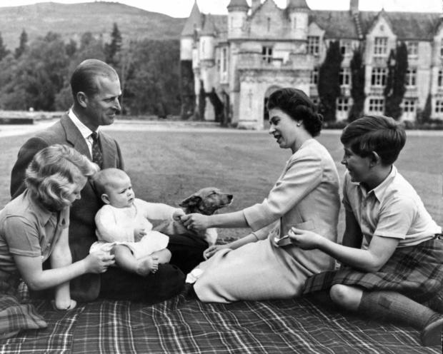 Queen Elizabeth II and her husband Prince Philip, Duke of Edinburgh, with their children Princess Anne, Prince Charles (right) and Prince Andrew on his first holiday to Balmoral