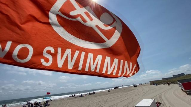 A "no swimming" flag flies at a Jersey Shore beach. 