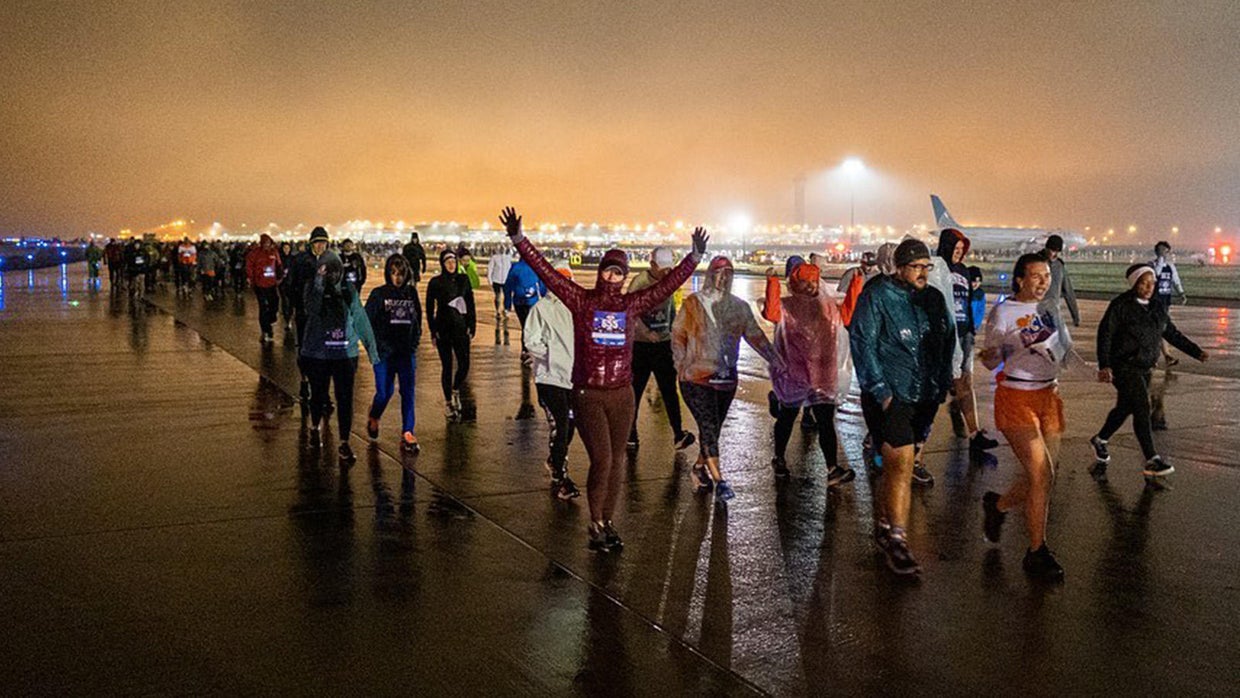 Runners brave cold, soggy weather for first-ever 5K on a Denver ...