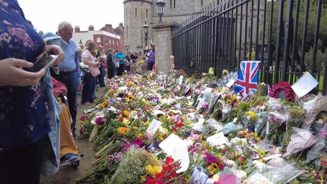 Hundreds of bouquets sit outside the gates of Windsor Castle. 