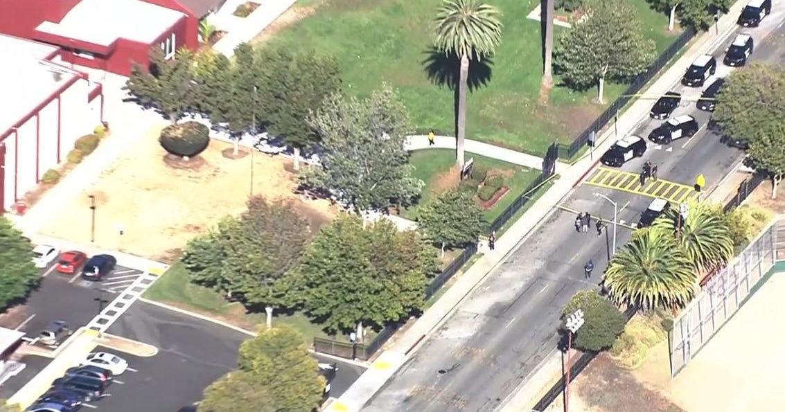 UPDATE: School staff member shot trying to break up fight outside