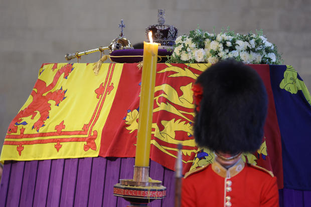 A royal guard stands next to the coffin of Queen Elizabeth II 