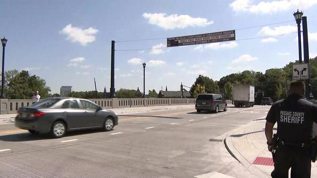 Vehicles drive across the Spruce Street Bridge in Paterson, New Jersey. 