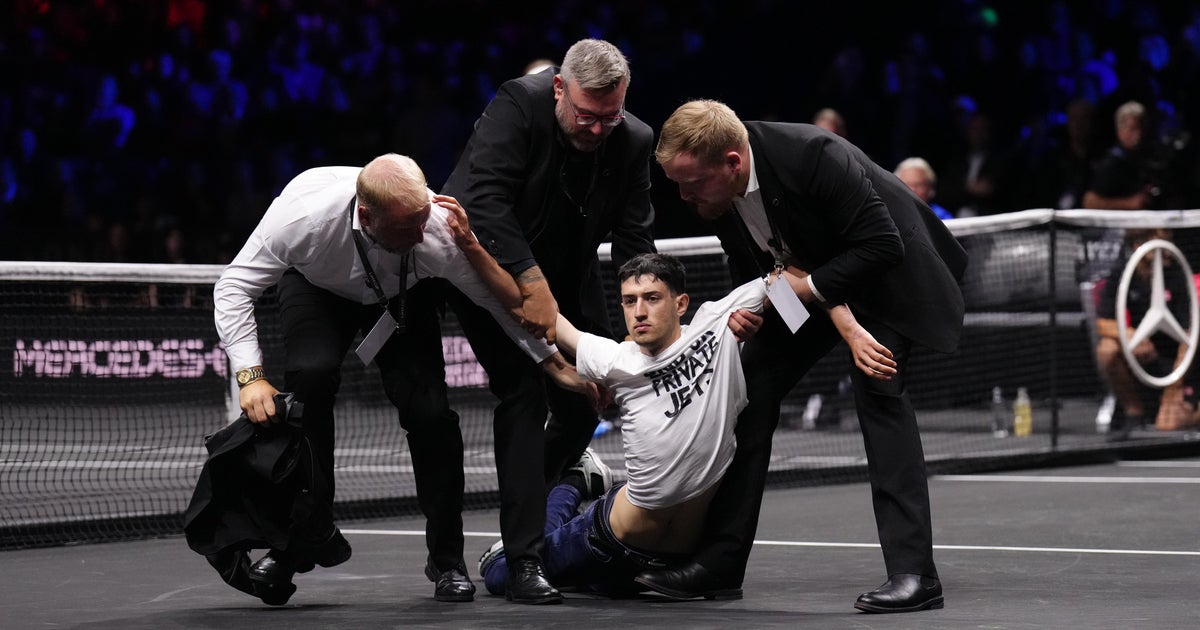 Protester lights arm and part of tennis court on fire during Laver Cup