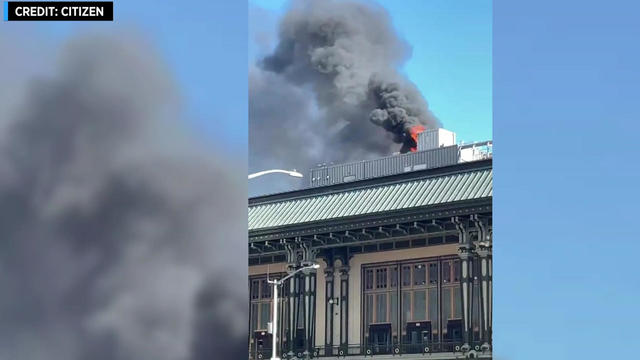 Flames and smoke poured out of the roof of the Governors Island ferry terminal in Lower Manhattan on Sept. 24, 2022. 