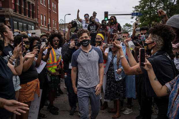 Minneapolis Mayor Jacob Frey is shouted at by protesters at a Defund the Police march to protest the killing of George Floyd in police custody in Minneapolis, June 6, 2020 (Victor J. Blue/The New York Times) 