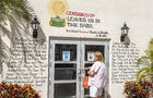 Coral Gables, Florida, Miami Books & Books bookstore, censorship banned books list on exterior wall 