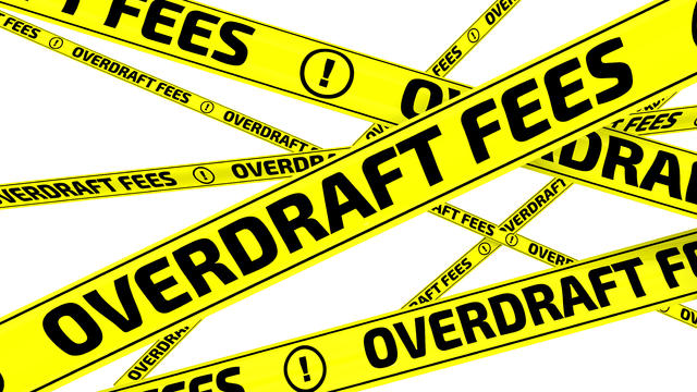 Overdraft fees. Yellow warning tapes 