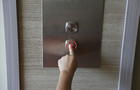 Cropped Hand Of Girl Pressing Elevator Button 