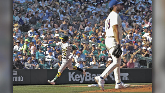 Angels score 11 in 3rd inning, thump Fujinami and A's 13-1