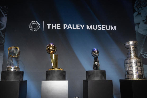 The MLB's Commissioner's Trophy, NBA's Larry O'Brien Trophy, NFL's Vince Lombardi Trophy and NHL's Stanley Cup are displayed all together at PaleyWKND outside the Paley Museum on October 01, 2022 in New York City. 