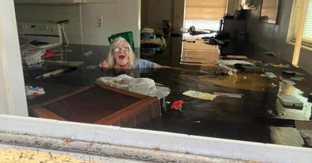 Dramatic images show son rescuing 86-year-old mother from Ian's floodwaters in Florida