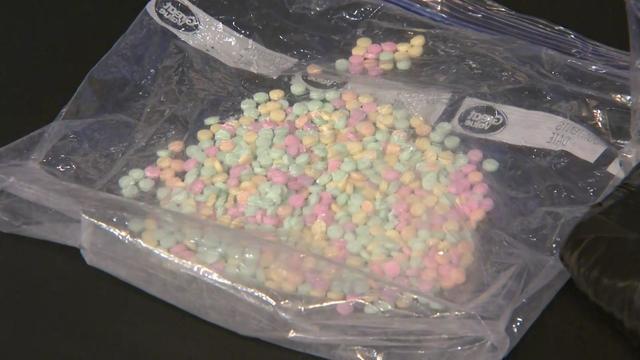 A plastic bag full of rainbow fentanyl pills. 